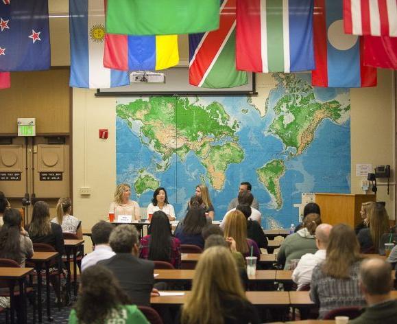 students sitting in class with flags above them